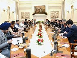 Iranian and regional diplomats in discussion around a conference table