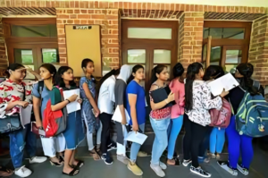 Students queuing outside Hansraj College campus gate