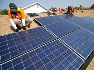 Villagers gathered around a digital kiosk viewing real-time data from their local floating solar farm