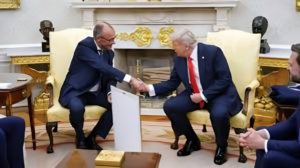 President Trump and Chancellor Merz shaking hands in the Oval Office