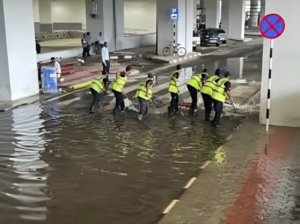 Rain‑lashed runway at Delhi IGI Airport during monsoon showers