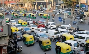 Delhi skyline with mixed-age vehicles on road