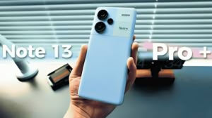 Redmi Note 13 Pro Max smartphone in hand showcasing curved AMOLED display