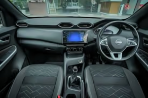 Interior dashboard showing infotainment and cluster in Nissan mid-size SUV