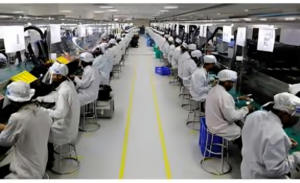Engineers inspecting Apple component production lines at a U.S. manufacturing facility